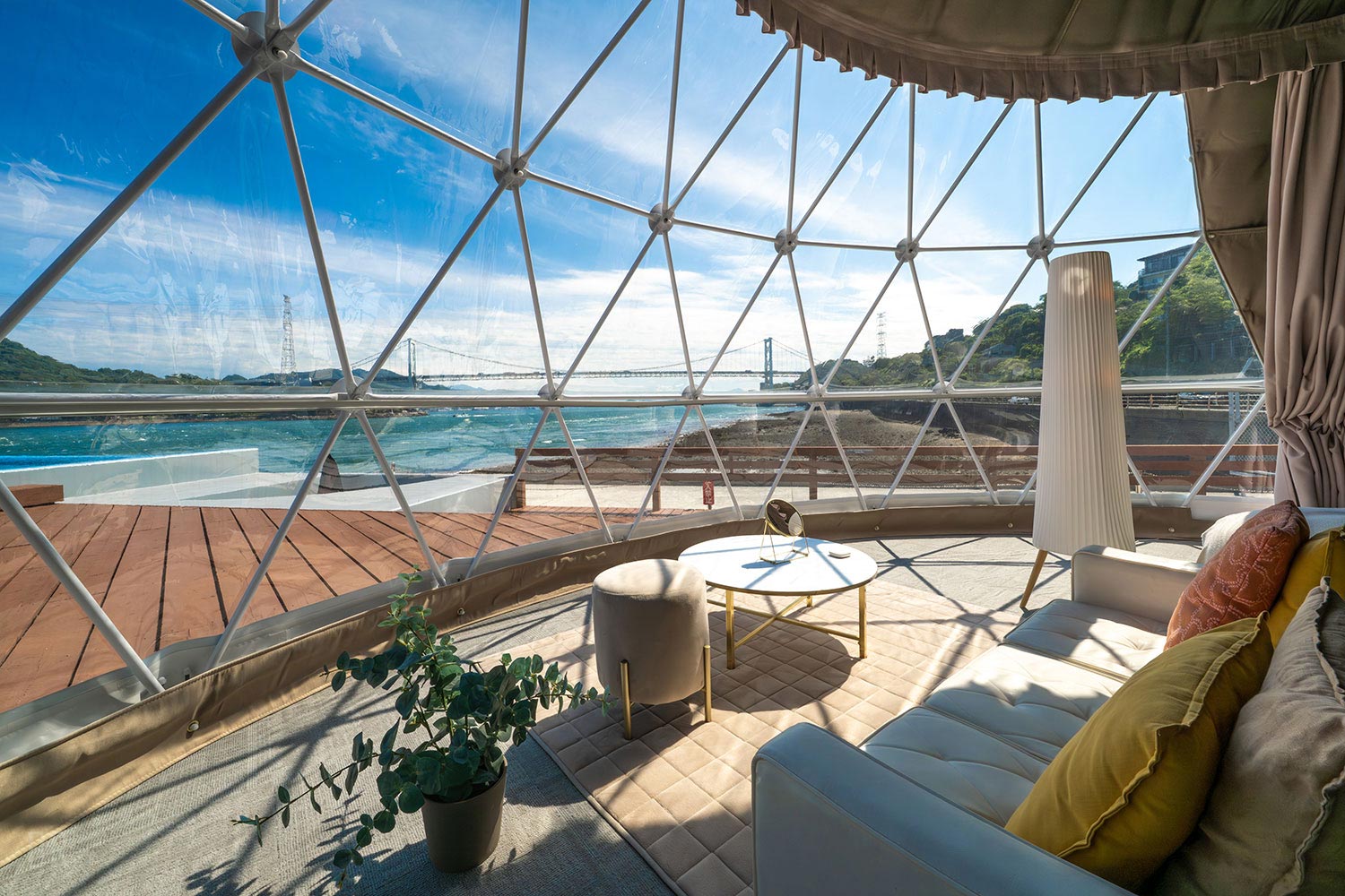 Scenery viewed from inside GLAMP DOME SHIMONOSEKI on a sunny day